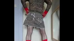 gay crossdresser enjoying the taste of his two glasses of pee that has just come out of his cock