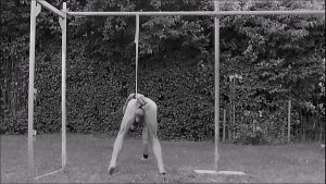 naked pathetic slave exposed outdoor, tied up at testicles, may play dildo in ass, humiliating body writing, BDSM CBT