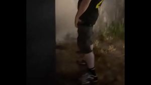 Helping him pee in the street