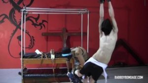 Masked Damien is bound and flogged by master Ryann